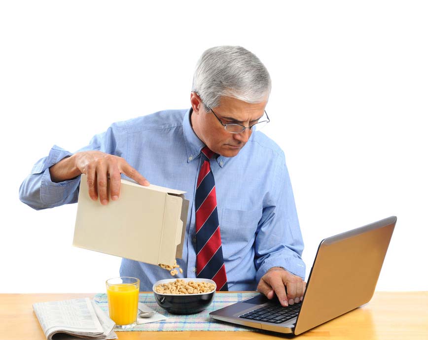 Middle Aged Man Pouring Cereal into a Bowl